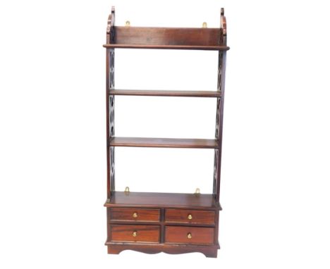 A mahogany wall shelf, with pierced supports and four drawers, 119cm high, 53cm wide.