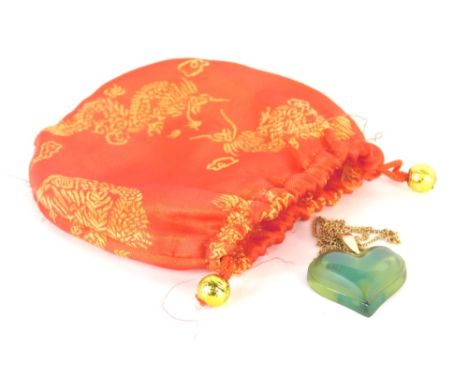 A Lalique heart shaped pendant and chain, the green glass faceted heart pendant signed Lalique France (AF) with a gold colour