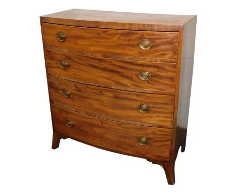 An early 19thC mahogany box wood strung chest of drawers, with a plain caddy top, above four graduated drawers, each with ova