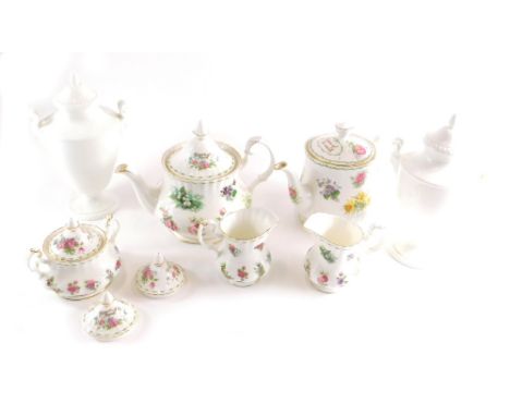 A Queens fine bone china teapot, various Royal Albert Flowers of the Month part teaware, milk jugs, two handled sugar bowl, p