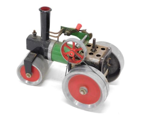 A Mamod style steam tractor, with green and black centre and chrome wheels with red trim, unmarked, 20cm high.