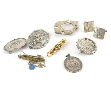 A group of silver and other jewellery, comprising two oval floral silver brooches, a pierced circular Victorian brooch, regis