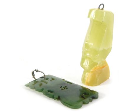 Two carved pendants, comprising a carved jade pendant, with leaf scroll detail and open work cross centre, 7.5g, together wit