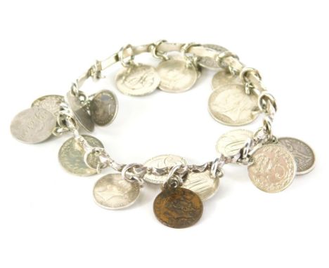 A silver coin bracelet, the bangle of hammered design, with various applied coin drops, 47.9g all in.   Provenance Colston Fa