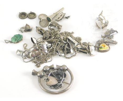 A group of silver and other costume jewellery, comprising a thistle scarf pin, part coin bracelet, silver neck chains, silver