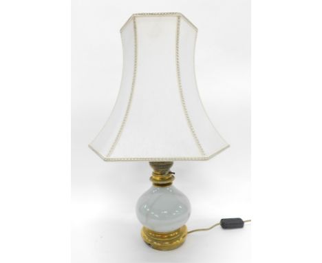 A pottery table lamp with material shade, 64cm high.