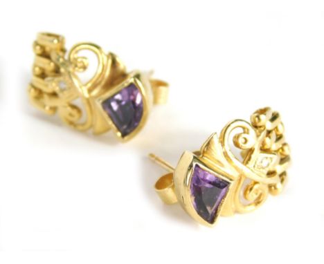 A pair of amethyst and diamond drop earrings, each with a triangle cut amethyst top, on scroll design basket, with graduated 