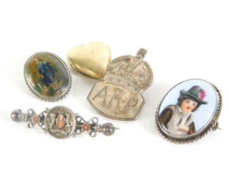 A group of costume jewellery, comprising a silver ARP cap badge, silver bar brooch lacking back, two portrait oval miniatures