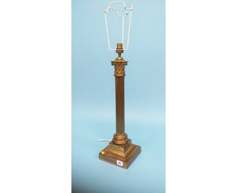 A metal ware Corinthian column table lamp