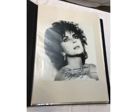 A collection of 55 autographs and signed photographs including; Elizabeth Taylor, Graham Hill, Harvey Keitel, Olivia de Havil