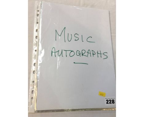 Music autographs; a collection of 11 individuals and groups including Queen (3 members), Crystal Gayle, Johnny Cash, Frank Si