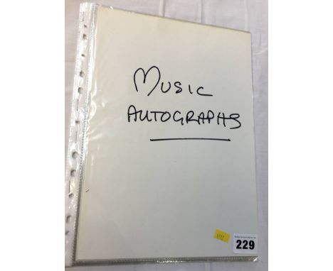 Music autographs; a collection of 11 individuals and groups, including Bob Dylan, Glen Campbell, Cliff Richards, U2, David Bo