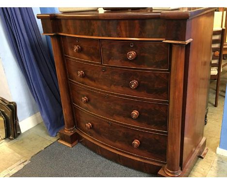 A Victorian mahogany bow fronted chest of drawers, with cushion drawer below two short and three long graduating drawers, sup