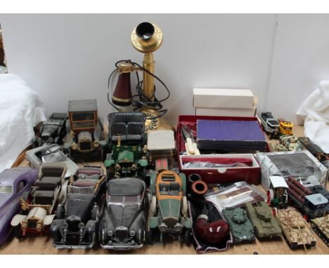 A Franklin Mint model of a Duesenberg Coupe Simone, together with other model and toy cars, stick telephone, pipes, flatwares