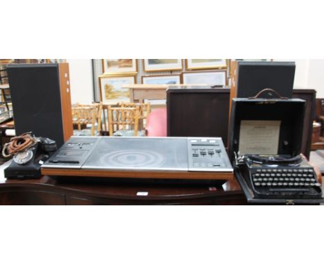 A Bang and Olufsen Beocenter 2002 record player and speakers (sold as seen, untested), together with a Bakelite telephone"312