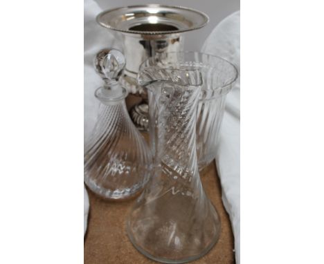 A wine cooler and glass decanter