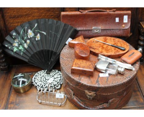 A snake skin hat box together with crocodile effect music case, silver handled knives, silver handled fish set, magic lantern