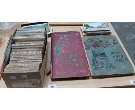 Two post card albums together with loose postcards