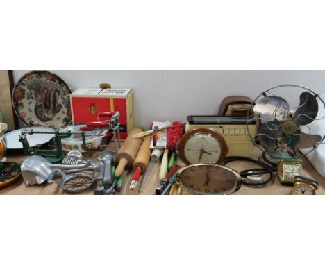 A Limit desk fan together with a Hermle mantle clock and four other clocks and travel alarm clocks and kitchenalia