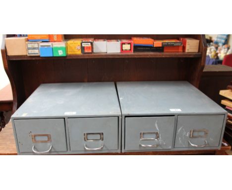 A pair of grey metal card index filing cabinets together with a table top filing cabinet and photo slides