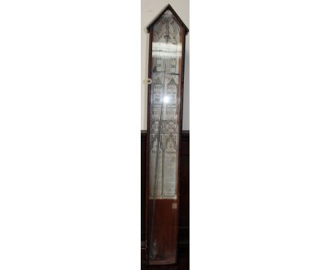 An Admiral Fitzroy barometer with pointed arched top and paper labels