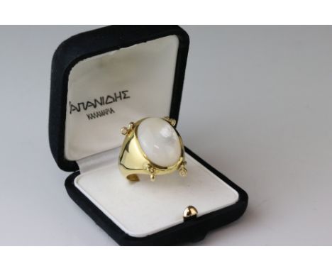 Mother-of-pearl and diamond 18ct yellow gold ring, the cabochon cut mother-of-pearl measuring approx 21mm x 16mm x 6.5mm, fou