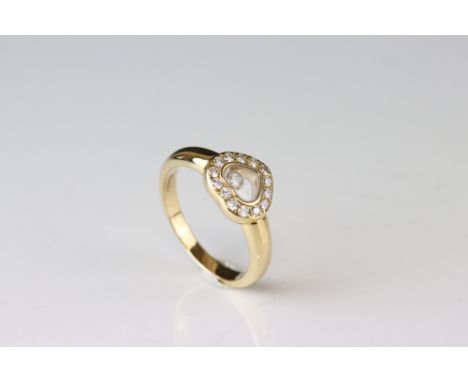 Chopard Happy Diamonds diamond 18ct yellow gold heart ring, the heart shaped compartment containing a freely moving collet se