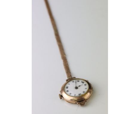 Early 20th century 9ct gold cased wristwatch, white enamel dial with black Roman numerals and poker hands, 1915 London import