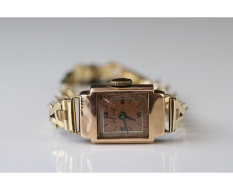Accurist ladies 9ct rose gold cased wristwatch, coppered dial, black Roman numerals and baton markers, pencil hands, rolled g