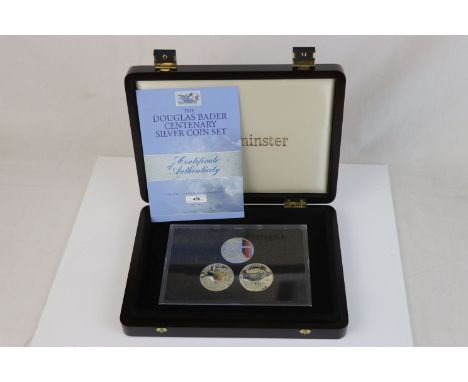 A cased limited edition Westminster Mint Douglas Bader Centenary silver coin set to include three silver proof £5 coins with 