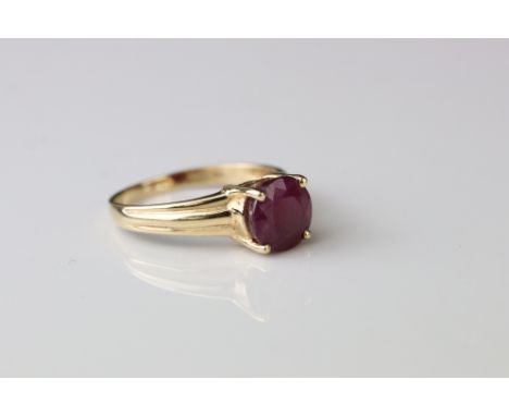 Ruby 14ct yellow gold solitaire ring, four claw setting, textured shoulders, ring size P½ 