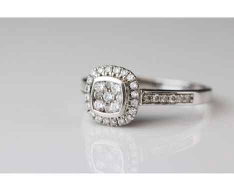Diamond cluster 18ct white gold ring, nine small round brilliant cut diamonds to central cluster, square collet setting, twen