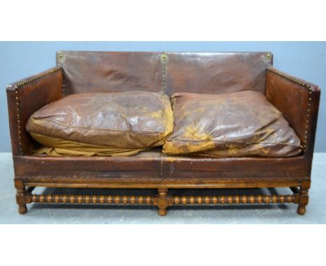 Early 20th century  brown leather sofa, stud fastening, on bobbin turned legs and stretcher  155 cm wide 