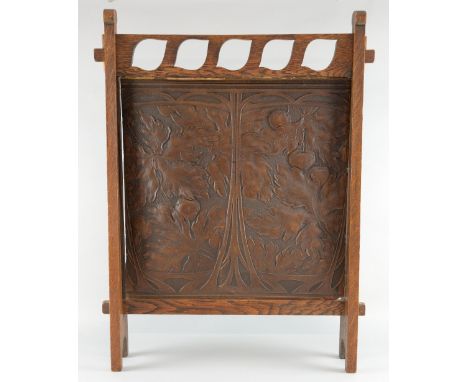 Liberty and Co,oak and leather fire screen, circa 1900 with pierced top rail and embossed foliate design applied 'Leatho' lab
