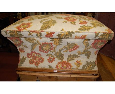 A Victorian mahogany and floral tapestry upholstered hinge topped ottoman, of waisted form and on bun supports, w.88cm