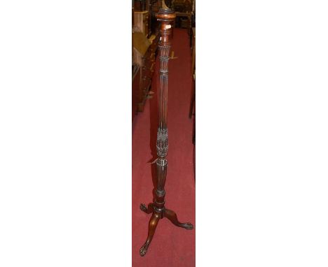An early 20th century mahogany reeded, turned and floral carved standard lamp (lacking fittings), h.149cm