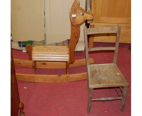 A contemporary pine childs rocking horse; together with a panel seat childs bedroom chair, and a childs folding picnic table 