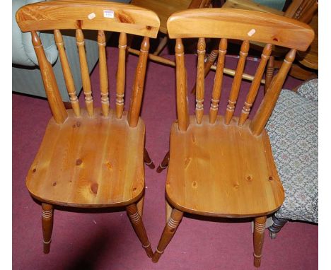 A set of four modern pine stick back kitchen chairs, together with an oak slatback swivel desk elbow chair (5)