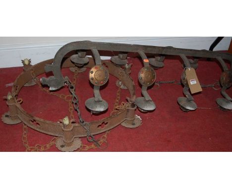 A Continental wrought iron 8-branch candle hanging ceiling light, together with a similar circular six light example (2)