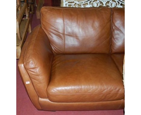 A contemporary  tan leather three-seater sofa, width 185cm