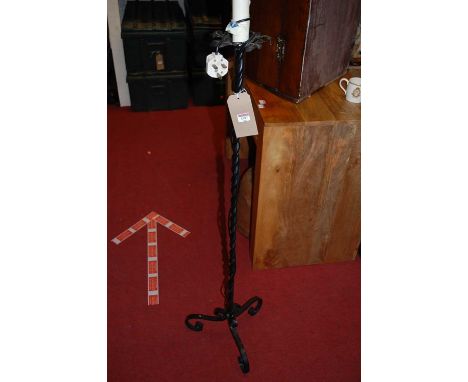 A black painted wrought iron spiral turned standard lamp, height 142cm