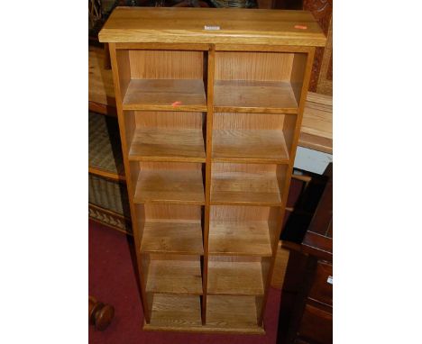 A contemporary light oak freestanding open CD rack, width 47.5cm