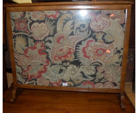 A Victorian mahogany and floral tapestry embroidered pole screen; together with a Victorian mahogany and floral tapestry inse