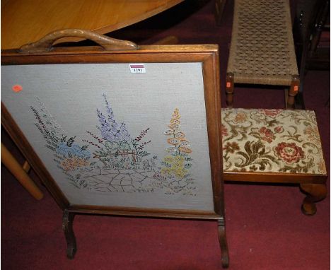 An early 20th century oak framed and tapestry inset fire screen, together with a long footstool, and a further woven top foot