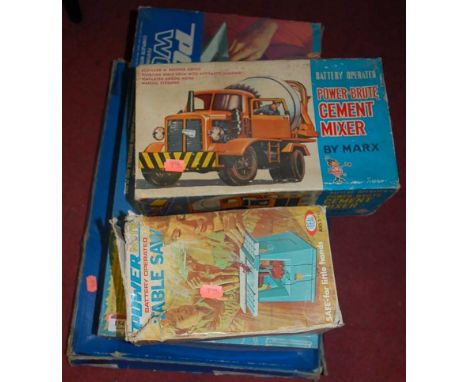 A boxed Marx cement mixer, boxed Powermight table saw,  boxed Powermight Workshop, and a tinplate speedway and cars