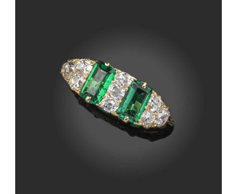 An emerald and diamond half-hoop ring, late 19th century, the two step-cut emeralds alternating with old cushion-cut diamonds