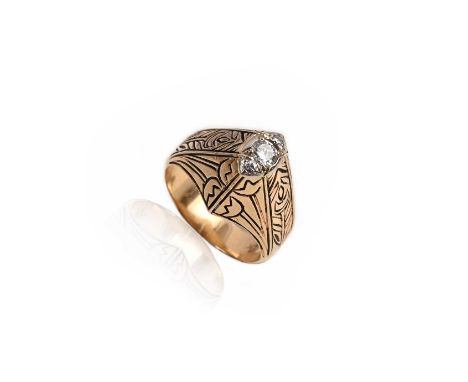 A gold and diamond ring, centred with three graduated round brilliant-cut diamonds in a raised yellow gold surround decorated