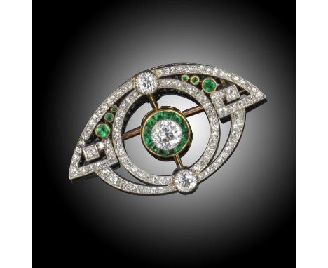 An Art Deco emerald and diamond brooch pendant, centred with a circular-cut diamond within a surround of emeralds, in two fur
