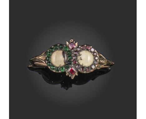 A late 19th century dendritic agate ring, the two circular plaques within a surround of garnets and emeralds respectively in 