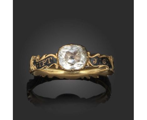 A late 18th century rock crystal memorial ring, centring on a cushion-shaped rock crystal within black enamel band with the w